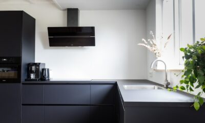 black flat screen tv mounted on white wall